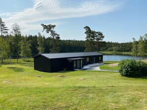 Lake-front building with bedrooms and lounge room overlooking the lake