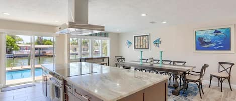 Kitchen Dining - pool now has a white picket fence in place from inlet 