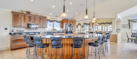 This kitchen island goes on for days. Room for everyone.