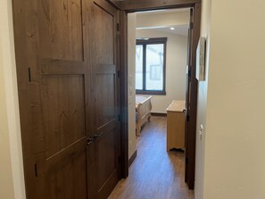 Hallway to Master (laundry on left)