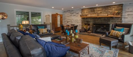 Stone fireplace and accent wall in living room