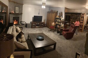 Main living room with real fire place-huge window with an amazing view