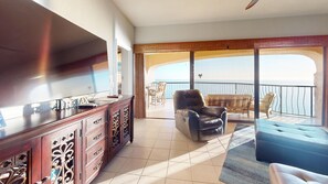 Comfortable leather seating in the living and 70" TV with DirecTV cable!