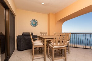 Balcony high top dining table. Notice the large electric grill and ocean views!
