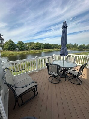 Back deck with beautiful pond stocked for fishing.