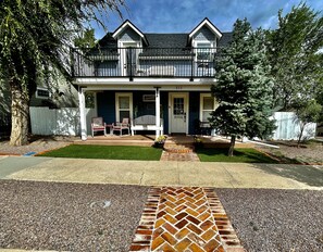 Follow the RED BRICK road to this adorable, fully remodeled 1914 FARMHOUSE. 