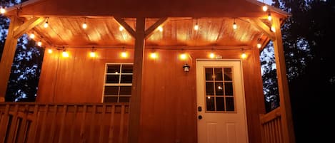 covered porch with lights