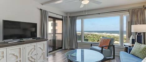 Ocean view living room with sliding doors that open to the balcony
