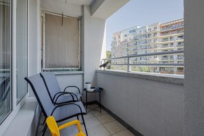 Balcony with cozy seating.