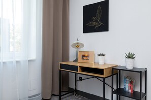 Minimalist workspace with a desk and natural light.
