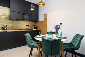 Dining area with a modern table and comfortable chairs.