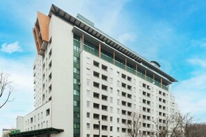 Exterior view of the apartment building with a modern design.
