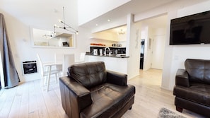 Living Room looking into kitchen and dining room