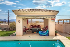 Closed patio with fire pit.