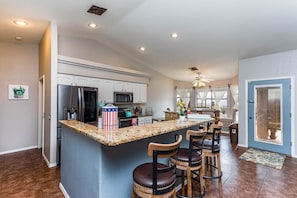 Open concept and fully stocked kitchen.