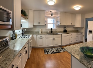 Kitchen stocked w/Calphalon stainless cookware and all the tools!