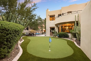 Putting Green With Pool Area in Background