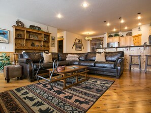 Spacious Living room connected to balcony with gas grill.