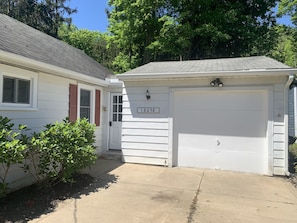 Pull in, park in front of the garage, use door to the left with keyless-entry