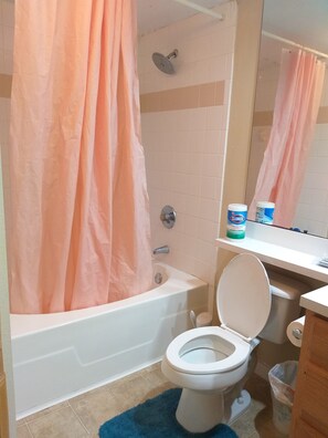 Bathroom with tub and shower