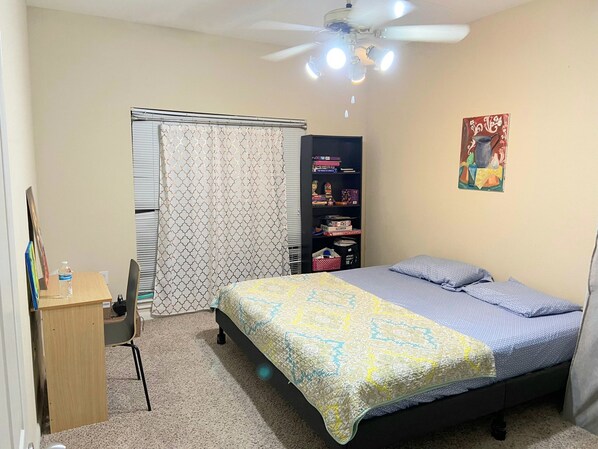Bedroom with a study table and a chair
