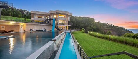 The singular Waterfalling Estate at sunset.