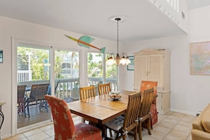 The dining room is adjacent to the screened-in patio, for indoor-outdoor dining