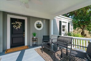 Cozy front porch perfect for coffee or cocktails. 