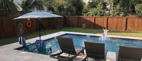 Or cool off on the pool ledge under an umbrella!