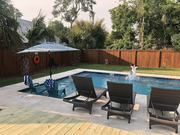Or cool off on the pool ledge under an umbrella!