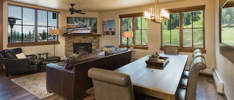 Main Living and Dining Spaces (Gas Fireplace, TV and Deck).  New hard wood floors