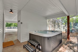 Enjoy a soak in the four person hot tub.