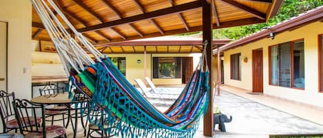 Patio area with covered-solar heated pool, bbq area.