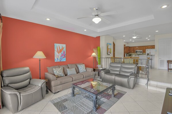 Relax in the expansive living room, offering plenty of space to unwind and gather with loved ones.