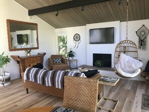 Living room with fireplace and TV