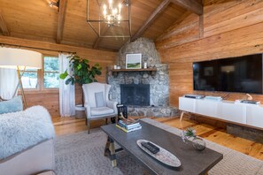 Great room for gathering around the fireplace or to watch a movie
