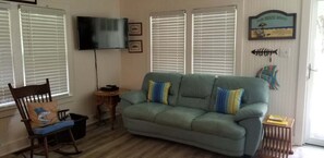 Den area with Smart TV.