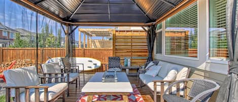 Lots of room to entertain and visit in the gazebo with fire table!