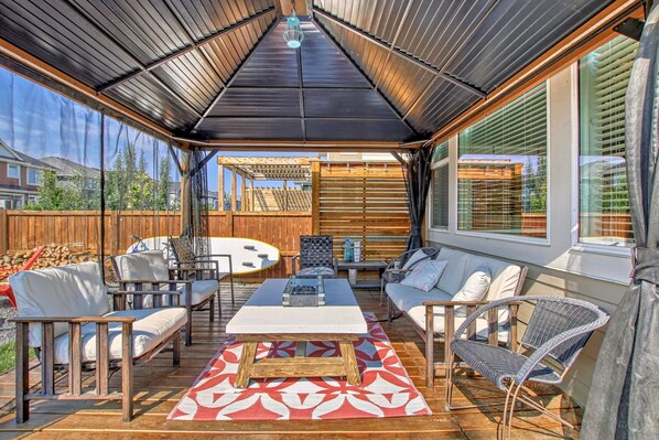 Lots of room to entertain and visit in the gazebo with fire table!