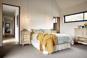 Master bedroom with queen bed, ensuite and mount view