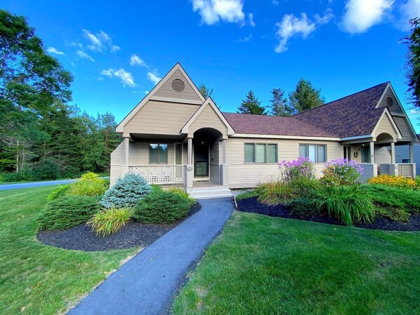 This two-bedroom condo with modern amenities—including an EV charger for your convenience—offers both comfort and location in one of New Hampshire's most picturesque settings.