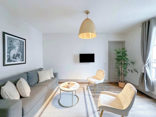 Living room with double sofa bed bed, TV, and free WiFi