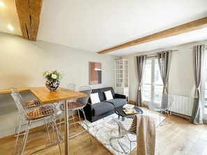 The living room is very cosy regarding the city