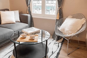 Take a peaceful moment on this comfy living room with your favorite book in hand.