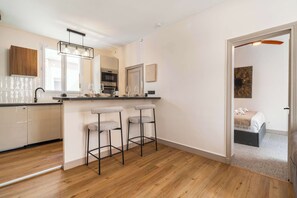 Enjoy entertainment with a flat-screen TV, fast Wi-Fi, and a comfy sofa in the living room.