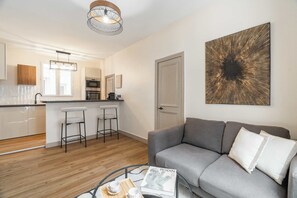 The spacious living room regarding the kitchen.