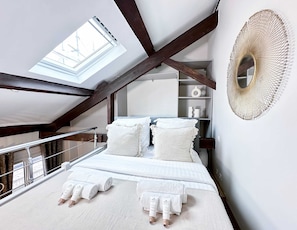 Master bedroom featuring a luxurious queen-size bed for a serene night's sleep.