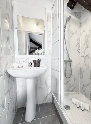 Modern bathroom featuring a sleek and spacious shower.