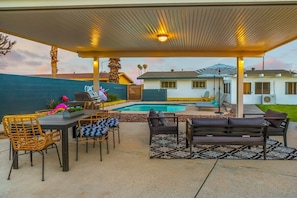 Plenty of outdoor sitting under the lighted coverd patio.