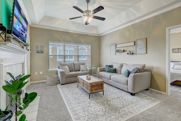 Living room with Full Sleeper Sofa and SMART TV. YouTube TV will be provided. :)
